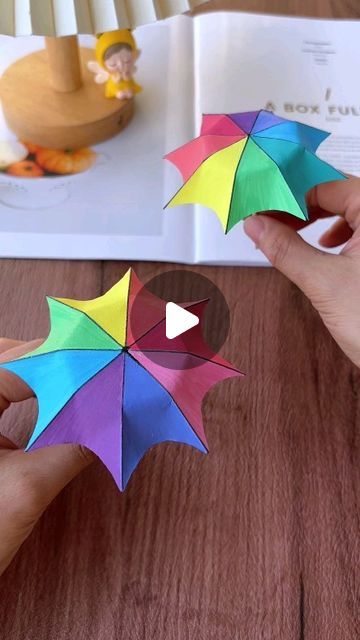 Paper Craft Ideas on Instagram: "Learn how to make a cute paper umbrella with this fun and easy tutorial! Follow along as we cut, fold, and secure colorful paper to create a charming umbrella, complete with a handle and personalized decorations. Perfect for kids and adults alike, this project is a delightful way to spend your crafting time. Join us and make your own adorable paper umbrella!" Easy Umbrella Crafts For Kids, How To Make A Paper Umbrella, Folding Paper Crafts Easy, Umbrella Making Craft, How To Make Umbrella With Paper, Paper Folding Crafts For Kids, Umbrella Craft For Kids, Paper Umbrella Craft, Umbrella Craft