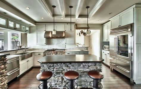 Gourmet chefs kitchen with high end appliances and breakfast bar with bar stools Kitchen Island Materials, Chefs Kitchen Design, High End Appliances, Gourmet Kitchen Design, Log Home Kitchens, House Aesthetics, Amazing Kitchens, Major Kitchen Appliances, Kitchen Appliance Storage