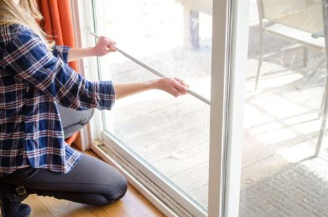 If you have a sliding door, then you know how easy it is to open compared to other doors. This can cause problems if you have young children or live in a less-than-safe neighborhood. To prevent children from opening the sliding door from the inside and burglars from the outside, place a tension rod in the door. Tension Rod Curtains, Hanging Potted Plants, Tall Kitchen Cabinets, Tension Rods, Hanging Folders, Craft Station, Safe Neighborhood, Tension Rod, Spice Storage