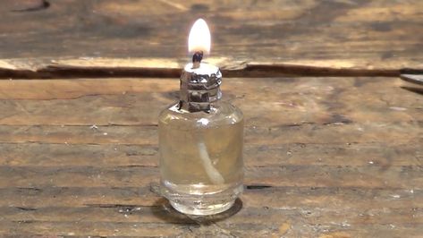 DIY Video: How to build a Simple Emergency Survival Waste Oil Candle from Old Nail Polish Bottle | Vegetable Oil Candles, Solar Thermal Water Heater, Survival Candle, Emergency Hacks, Barrel Stove, Diy Heater, Ceiling Fan Motor, Old Nail Polish, Nail Polish Bottle