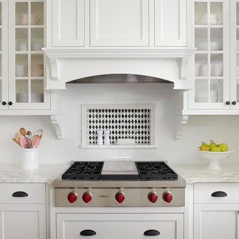 Backsplash Storage Niche A subway tile backsplash surrounds a rectangular niche that provides convenient storage for cooking necessities. The black-and-white diamond pattern in the niche adds subtle variation to the otherwise white kitchen but still blends with the room's traditional styling. Range Tile, Stove Backsplash, Unique Kitchen Backsplash, White Kitchen Backsplash, Kitchen Tiles Design, Brick Backsplash, Kitchen Backsplash Designs, Backsplash Designs, Kitchen Stove