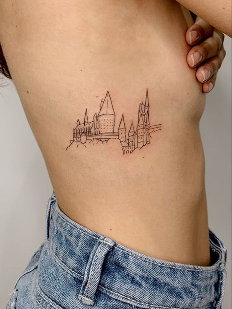 Simple Hogwarts Tattoo, Book Harry Potter Tattoo, Hogwarts Minimalist Tattoo, Harry Potter Tattoos Book, Hogwarts Skyline Tattoo, Harry Potter Tattoos Fine Line, Hogwarts Is My Home Tattoo, Book Tattoo Harry Potter, Harry Potter Rib Tattoo