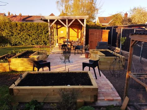 Patio built from reclaimed bricks. Raised beds incorporating bench seating from softwood sleepers. Flints set in square in centre. Reclaimed Brick, Bench Seating, Fruit And Veg, Raised Beds, Bench, Patio, Fruit, Square, Outdoor Decor