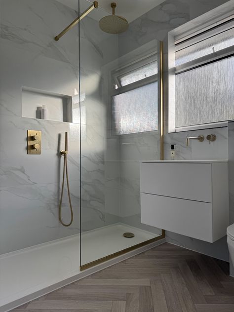 Shower With Gold Accents, Bathroom Herringbone Floor, Marble And Gold Bathroom, 1880 House, Marble And Brass Bathroom, Gold And White Bathroom, Bathroom Herringbone, Herringbone Bathroom, Brushed Brass Bathroom