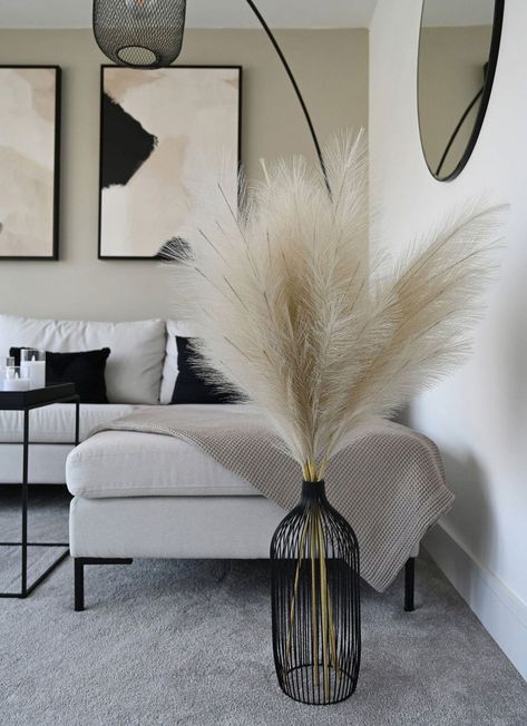 The Tall Nala Outline Vase in black makes a stunning statement and is perfect for our tall faux pampas. The sleek, slim shape of the vase gives height to any room and looks great stood on the floor or as a centrepiece. The contemporary design is ideal for any modern, minimalist home. #a #Ideas #InteriorInspo #Elevate #Stylish #and #Living #Space #HomeDecorating #Your #Living #Inviting #Inspiring #DecorInspiration #Room #DecorTips #for Living Room Decor Pampas, Pampas Grass Living Room Decor, Pampas Room Decor, Black Floor Vase With Pampas, Modern Accessories Home, Pampas Grass Black Vase, Black White Neutral Home Decor Living Room, Fireplace Vases Decor, Beige Couch Living Room Black Accents