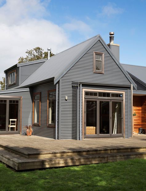 The owners of this Greytown home didn’t have an ultimate plan for their property, but in 10 years it has evolved from a cottage to a five-bedroom house Who lives here? Jo Lysaght (graphic designer and co-owner with sister Sharon of Caravan Homewares), Dave Murray (owner of 3D illustration and web design company Satellite Design), … New Farmhouse, Farmhouse Exterior Design, Farmhouse Architecture, House Cladding, Wood Architecture, Modern Farmhouse Exterior, Shed Homes, House Siding, Corrugated Metal