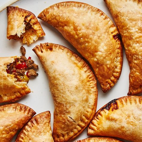 There are as many variations of empanadas as there are cooks in Argentina. This version was developed by BA Test Kitchen Manager Gaby Melian, who is from Buenos Aires and was taught as a little girl by family members how to make them. After years of perfecting her method, she prefers the empanadas baked, not fried, and the addition of green olives and raisins in the filling is essential. Baked Empanadas, Beef Empanadas Recipe, Chicken Empanadas, Beef Empanadas, Puff Pastry Dough, Empanadas Recipe, Pastry Dough, Filling Recipes, Puff Pastry