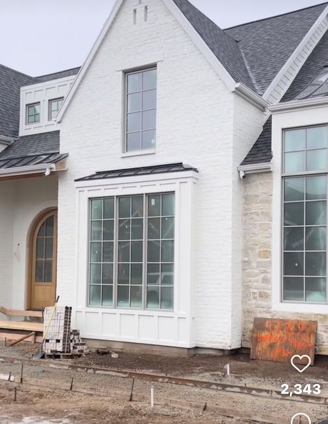 Home With Bay Window Exterior, White Brick With Stone Exterior, All Stone House Exterior, White Stone And Brick House Exterior, Cream Stone House Exterior, White Siding And Stone Exterior, Tan Windows Exterior, White Windows Exterior, European Home Exterior