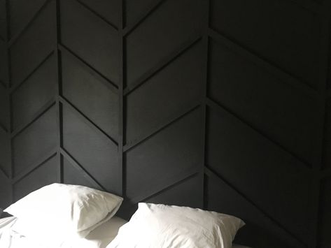 Herringbone bedroom wall in SW tricorn Black. Pretty easy project once you figure out appropriate spacing and angles. #bedroom #wallpanel #herringbone Bed In The Middle Of The Room Aesthetic, Black Focal Wall Bedroom, Black Herringbone Wall, Herring Bone Wall, Herringbone Bedroom, Sw Tricorn Black, Dormer Bedroom, Herringbone Accent Wall, Tricorn Black