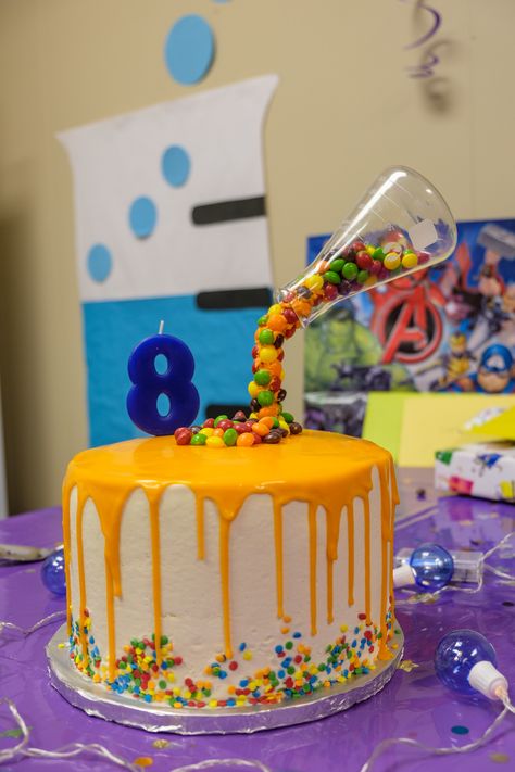 Rainbow layered drip cake - filled with Skittles and sprinkles. Science Lab Cake Ideas, Science Experiment Birthday Cake, Science Bday Cake, Stem Cake Ideas, Science Birthday Party Ideas Cake, Science Party Cake Ideas, Mad Science Cake, Science Birthday Party Cake, Mad Scientist Birthday Cake