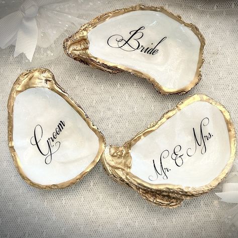 Oyster Shell Place Cards, Wedding Place Cards, Oyster Place Cards, Oyster Wedding Favor, Wedding Place cards, Wedding Decor, Pearl Wedding Handmade gifts for all of life’s special occasions. Shop on our Etsy link below https://www.etsy.com/shop/tidesoftimedesigns Custom Oyster Shell Mother of The Bride with Wedding Date - Thoughtful Gift for the Moms - Mother of the Groom - Step Mom, bridesmaids, bridal party, wedding rehearsal dinner guests, and more. ❤️Thank you for looking and hope we... Shell Wedding Favors, Oyster Shell Wedding, Oyster Shell Place Cards, Oyster Wedding, Shell Place Cards, Place Cards Wedding, Dinner Guests, Step Mom, Dinner Guest