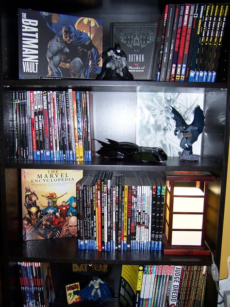 This is my Batman Bookcase...where I keep all of my graphic novels and Batman paraphernalia. Comic Book Display Shelves, Batman Inspired Room, Comic Book Shelf Ideas, Graphic Novel Collection, Batman Display Ideas, Batman Collection Display, Comic Collection Aesthetic, Comic Book Room Ideas, Comic Collection Display