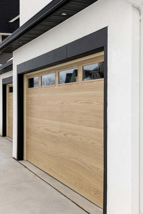 Light Wood Garage Doors White House, Black White Wood Exterior House, Modern Garage Door Styles, Faux Wood Garage Doors, Light Wood Garage Door, Modern Wood Garage Door, Modern Garage Doors Ideas, Garage Door Exterior, Garage Door Modern