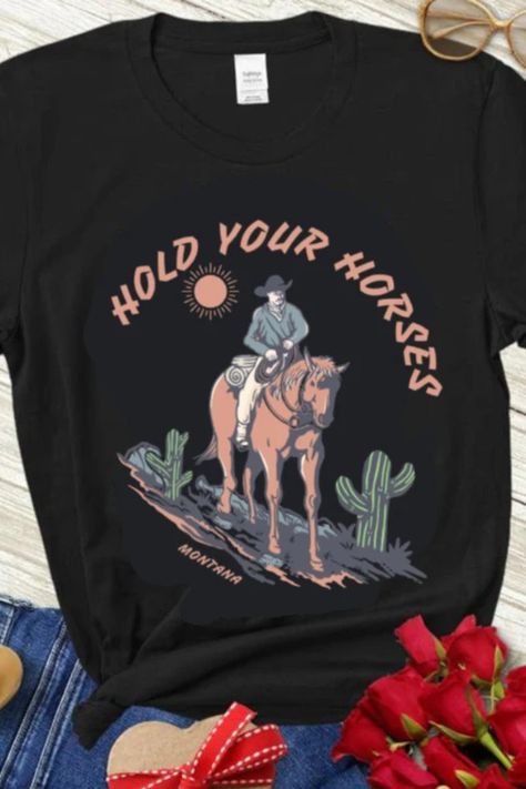 #HoldYourHorsesShirt #HorsesShirt #CowboyShirt #RodeoShirt #FunnyCowboyShirt #CountryShirt #WesternFashion #EquestrianClothing #HorseLovers #RodeoFans #FunnyTShirt #PatrioticShirt #RodeoStyle #CountryStyle #WesternWear Western Tees, Hold Your Horses, Retro Cowboy, Western Tee, Western Graphic Tees, Rodeo Shirts, Cowboy Shirt, Horse Shirt, Cowgirl Shirts