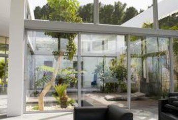 How to Decorate an Atrium | Home Guides | SF Gate Indoor Atrium, Atrium Ideas, Atrium House, Solar Windows, Large Greenhouse, Open House Plans, High Windows, Cube Table, Two Story Foyer