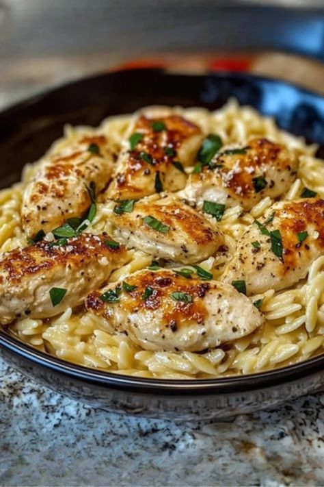 This delicious one-pan Creamy Parmesan Chicken and Orzo is the ultimate comfort meal. Tender chicken, creamy orzo, and rich Parmesan come together for an easy, satisfying dinner perfect for any night of the week. Whip up something special – get the recipe now #CreamyParmesanChicken #EasyDinnerRecipe #OnePanMeal #ChickenAndOrzo #ComfortFood #WeeknightDinner #QuickDinnerIdeas #FamilyDinner #ParmesanChicken #OrzoRecipe Cheesy Casserole Recipes, Chicken And Orzo, Creamy Parmesan Chicken, Orzo Dishes, Creamy Orzo, Orzo Recipes, Chicken Orzo, Cheesy Casserole, Creamy Parmesan