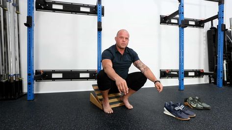 Learn how to use a slant board for improved mobility. Check out Dr. Kelly Starrett’s techniques, tips, and proper usage instructions. Benefits Of Squats, Slant Board, Lifting Shoes, Ankle Mobility, Calf Stretches, Squat Challenge, Olympic Lifting, Long Term Goals, Strength Training Workouts