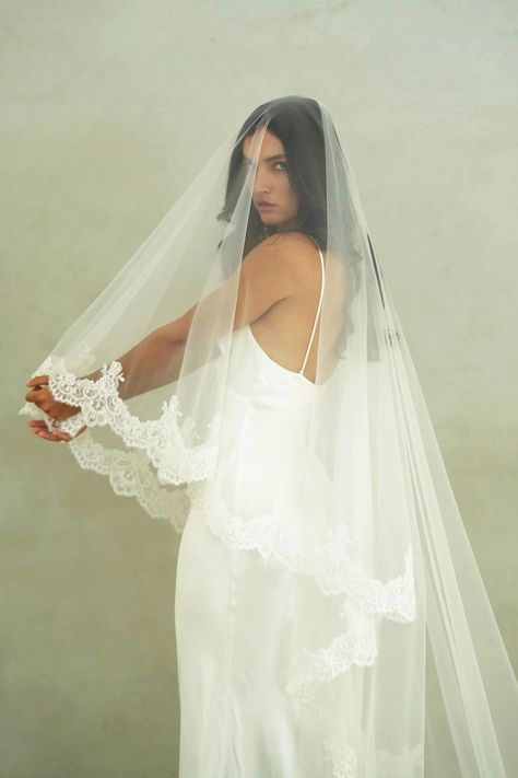 CHARLOTTE II - Drop Veil, Two Tier Lace Wedding Veil MADE TO ORDER * Handmade - all sales are final * Allow 4 - 6 weeks for production VEIL STYLE * Two-tier veil with corded lace trim * The veil is attached to a 3.5"/8.5cm wide metal wire comb VEIL SIZE * Chapel length 90"/228cm (shown)   * Cathedral 120"/308cm  TULLE * This veil is made with premium bridal illusion tulle COLOUR * Available in soft white (natural white) and ivory (warm white) * Need a tulle swatch? Order one here: https://www.et Lace Trim Wedding Veil, Lace Trim Veil With Blusher, Ruffled Wedding Veil, Veil Attached To Dress, Long Blusher Veil, Oui Jolie Bride, Vail Covering Face, Extremely Long Wedding Veils, Simple Wedding Accessories