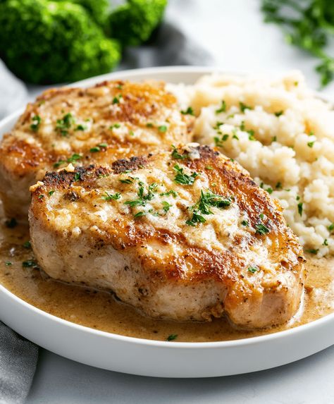 Juicy Garlic Parmesan Pork Chops cooked in a creamy, flavorful sauce. Perfect for a quick and easy dinner. Ready in just 30 minutes. Parmasean Pork Chops, Garlic Parmesan Pork Chops, Parmesan Pork Chops, Pork Seasoning, Parmesan Recipes, Italian Spices, Pork Ham, Parmesan Sauce, Quick And Easy Dinner