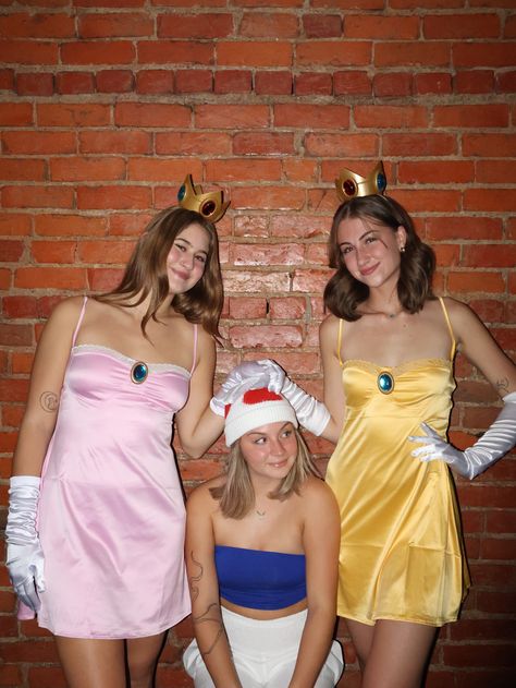 Princess peach, mario, princess daisy, toad, mario bros, mario kart, pink dress, silk gloves, crown, yellow dress, girls, friends, college, costume, fun, cute, outfit inspo, matching, toad, trio, yay Daisy Mario Cart Halloween Costume, Princess Peach Daisy And Rosalina Halloween Costume, Mario And Daisy Costume, Mario Horse Costume, Mario Dress Up, Fun Trio Halloween Costumes, Daisy Halloween Costume Mario, Peach Daisy And Rosalina Costume, Daisy Mario Kart Costume