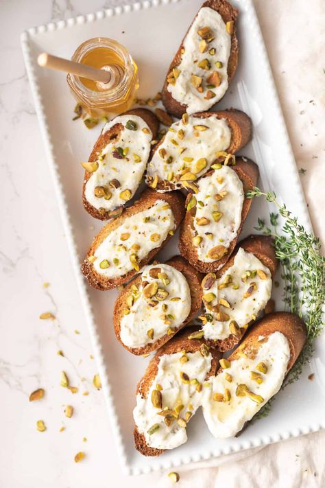 Whipped Ricotta Crostini with Honey and Pistachios - CC's Table | Easy Recipes for Entertaining Ricotta Crostini Appetizers, Crostini Ricotta Appetizers, Whipped Ricotta Pear Crostini, Whipped Ricotta Peach Crostini, Whipped Ricotta Crostini, Figs With Ricotta Pistachios And Honey, Ricotta Dip With Honey, Ricotta And Hot Honey Crostini, Fun Appetizers