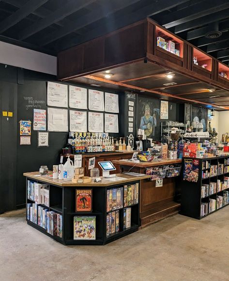 How-To Spielbound | Spielbound Board Game Cafe Game Store Interior Design, Board Games Coffee Shop, Board Game Cafe Aesthetic, Board Games Bar, Game Cafe Design Interior, Cozy Board Game Room, Board Game Cafe Interior, Board Game Bookshelf, Boardgame Cafe Design