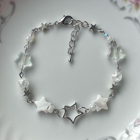 silver stars bracelet 🤍🌠 in stock on my etsy . . . . . . . #explore #explorepage #jewelry #beadwork #beads #beadsoup #charms #bracelets #etsy #etsyfinds #beadjewelry #beadbracelets #coquette Silver Star Bracelet, Beaded Chain Bracelet, Stars Bracelet, Bracelet Aesthetic, Charm Bracelet Silver, Bracelets Etsy, Metal Star, Charms Bracelets, Clear Beads