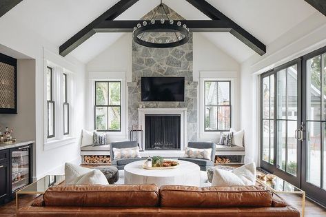 Gray stone fireplace flanked by built-in window seats and gray upholstered cushions. Grey Stone Fireplace, Built In Window Seat, Fireplace Style, Natural Stone Fireplaces, Statement Chandeliers, Cottage Living Rooms, Cottage Living, Fireplace Design, Stone Fireplace