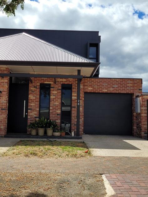 Red Brick House With Black Garage Doors, Red Brick And Black Exterior, Dark Red Brick House Exterior, Old Brick House Exterior Makeover, Colorbond Roofing, Brick Shed, Brick House Exterior Makeover, Brick House Colors, Red Brick House Exterior