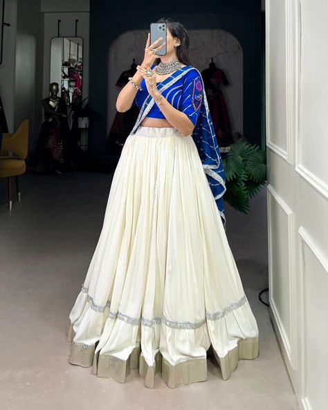 Rate : 1900 #apex__outfit Celebrate the festivities with flair in this plain white Navratri lehenga 🤍💙 Lehenga (Stitched) : Lehenga Fabric : Pure Rayon Lehenga Work : Plain With Embossed Design Gota Lace Border Lehenga Waist : Support Up To 42 Lehenga Closer : Drawstring With Zip Stitching : Stitched With Canvas And Full Inner Length : 41 Flair : 5.5 Meter Inner : Micro Cotton Blouse (Stitched) : Blouse Fabric : Pure Rayon (Fully Stitched) Blouse Work : Plain With Gamthi Patch Work And La... Plain White Lehenga, Long Skirt And Top Casual Simple, Lehenga Plain, Lehenga White, Navratri 2024, Lehenga Stitched, Long Skirt And Top, White Lehenga, Lehenga Fabric