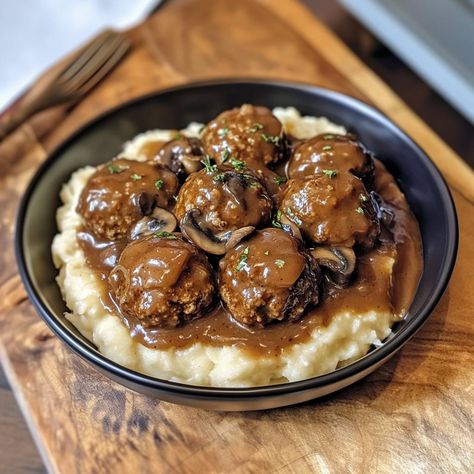 The Ultimate Salisbury Steak Meatballs with Mushroom Gravy is a dish that brings warmth to your table. This classic recipe combines juicy meatballs with a rich and flavorful mushroom gravy. It's perfect for family dinners and will make everyone ask for seconds! Why Make This Recipe This recipe is not only delicious but also simple Meatball And Gravy Recipes, Meatball And Gravy, Meatballs With Mushroom Gravy, Lobster Cream Sauce, Cheeseburger Meatloaf, Baked Meatloaf, Crockpot Meatloaf, Juicy Meatballs, Salisbury Steak Meatballs