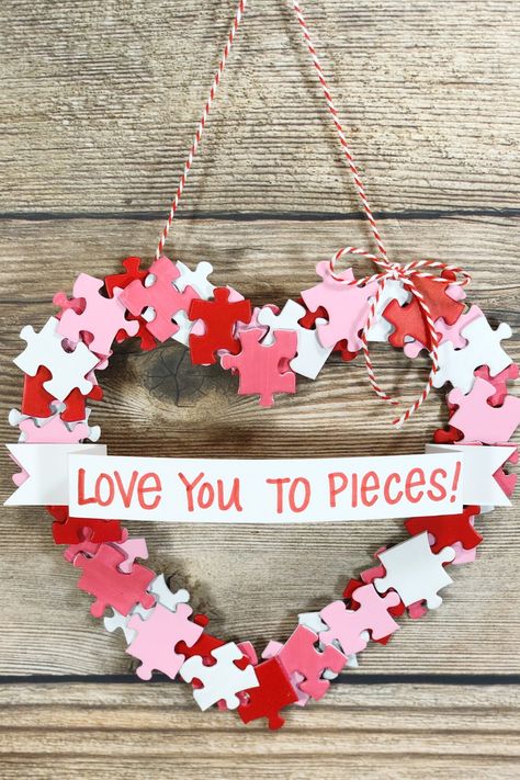 How adorable is this Valentine's Day wreath? Not only that, it's also easy to make and cheap too! Grab a children's dollar store puzzle and a few craft supplies and you're set! #ValentinesDayCrafts #kidscrafts #diywreath #valentines Puzzle Piece Art, Valentines Puzzles, Puzzle Piece Crafts, Valentine Wreath Diy, Love You To Pieces, Pink Crafts, Valentine's Day Crafts For Kids, Puzzle Crafts, Valentines Crafts