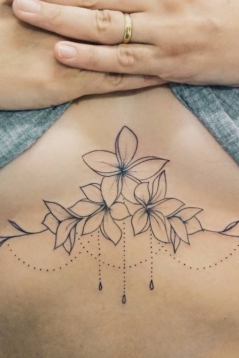 45 Sexy Underboob Tattoos You’ll Want to Get ASAP Underbreast Tattoo, Underboob Tattoos, Chandelier Tattoo, Sternum Tattoo Design, Underboob Tattoo Designs, Underboob Tattoo, Cool Chest Tattoos, Small Tattoos Simple, Chest Tattoos For Women