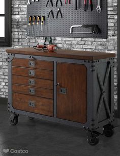 This sturdy, industrial-style inspired rolling workbench is the ideal blend of rugged powder-coat steel with a solid wood-top.  A rich hand-applied finish sets off this workbench, offers handsome practicality to your work shop, garage or any creative work space you can imagine. Meja Industrial, Rolling Workbench, درج السلم, Work Benches, Welded Furniture, Tool Stands, Vintage Industrial Furniture, Garage Cabinets, Garage Shop