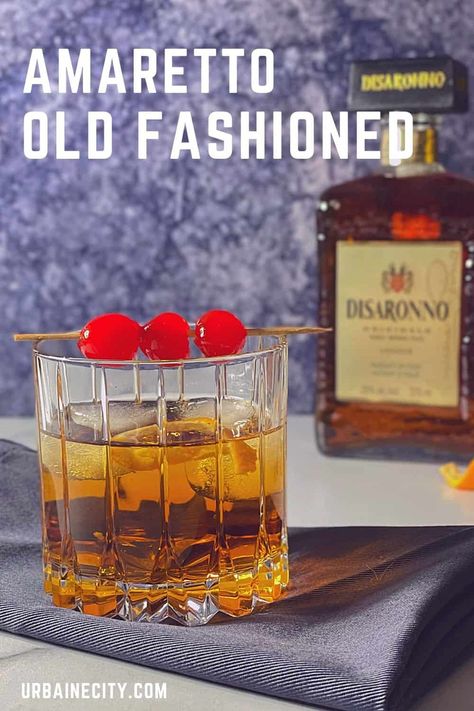 The Old Fashioned is a classic and timeless cocktail. In this version, we add a touch of amaretto that goes wonderfully with bourbon thanks to its notes of vanilla and almond and a touch of maple syrup. New Old Fashioned Cocktail, Old Fashioned With Amaretto, Types Of Old Fashioned Drinks, New Fashioned Cocktail, Italian Old Fashioned Cocktail, Amaretto Old Fashion, Vanilla Old Fashioned Cocktail, Sweet Old Fashioned Cocktail, Bourbon Amaretto Cocktails