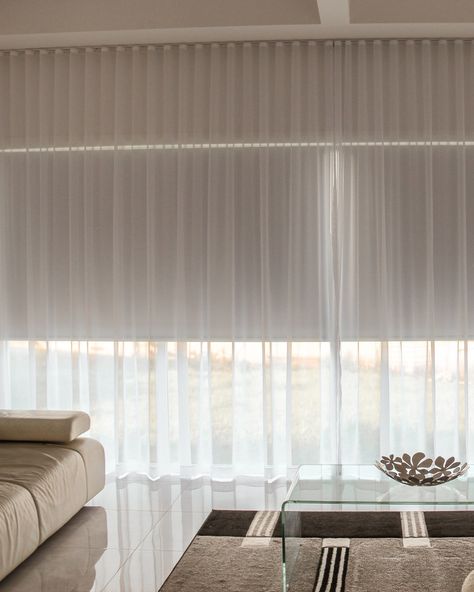 ✨ Transform Your Living Space with Style! ✨ Upgrade your home with our elegant sheer curtains and roller blinds. This stunning living room features a clean, modern design perfectly complemented by our window treatments. 🏡 Create the perfect blend of light and privacy. 💫 Elevate your home's aesthetic effortlessly. 🌟 Visit us at The Blind Factory for more inspiration! #HomeDecor #InteriorDesign #WindowTreatments #ModernLiving #TheBlindFactory #SheerCurtains #RollerBlinds Roller Blind With Sheer Curtain, Roller Blinds With Sheer Curtains, Blinds And Curtains Together, Curtains Over Blinds, Roller Blinds Living Room, Sheers Curtains Living Room, Built In Shelves Living Room, Voile Curtains, Roller Blind