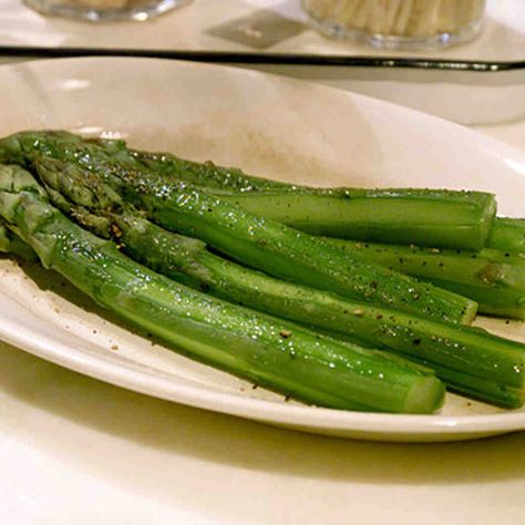 Boiled Asparagus Recipe | Martha Stewart Boiled Asparagus, Boil Asparagus, Mint Butter, Low Calorie Sides, Easy Vegetable Side Dishes, Martha Stewart Recipes, Steamed Asparagus, Steak Dinner, Asparagus Recipe