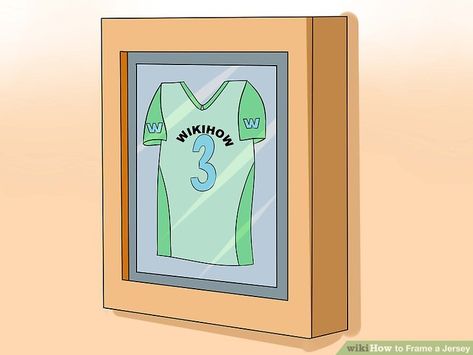 How to Frame a Jersey: 8 Steps (with Pictures) - wikiHow Shadow Box Jersey, Tiny Man Cave Ideas, Man Cave Bar Diy, Folding Shirts, Repurpose Picture Frames, Fold Clothes, Jersey Display Case, Jersey Display, Ultimate Man Cave