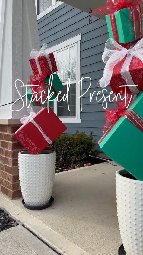 Learn how to craft stunning stacked present planters for your Christmas yard decorations. This simple DIY project adds a cheerful touch to your holiday outdoor space, making it uniquely festive and inviting. #DIYChristmasYardDecorations #HolidayDecorIdeas #ChristmasPlanters #FestiveOutdoorDecor #EasyDIYProjects Outside Christmas Display Ideas, Outdoor Stacked Christmas Presents, Diy Christmas Decorations For Outside Wood, Present Stacking Ideas, Outdoor Christmas Packages Diy, Diy Outdoor Xmas Decor, Outdoor Christmas Gift Boxes Diy, Stacked Presents Decoration, Diy Outdoor Wooden Christmas Decorations