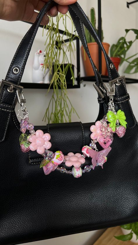 You don't need a new bag, you just need to charm! I created these chains to freshen up your old and new accessories, to personalize them and make them more unique to you!  Chain Length approx: shorter strap 11" , longer strap hangs 12"  + 6 handmade charms Colors: pink, green, white, silver  Materials, Metal, handcrafted beads, ceramic beads, plastic beads Collection: Strawberry Dew  Bag chains are not meant to hold weight but to decorate your accessories Bag Chains Accessories, Bag Chain Beads, Personalized Bags Ideas, Bags With Keychain, Decorate Bag Ideas, Aesthetic Bag Charms, Bag Chain Accessories, Purse With Charms, Purse Accessories Ideas