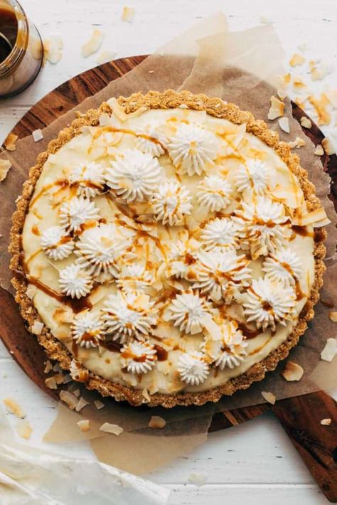 This is not your average coconut cream pie. It's set with a layer of homemade salted caramel and incased in a toffee-like coconut graham cracker crust. It's so easy to make and is a fun way to spice up a traditional coconut cream pie recipe. #coconutcreampie #coconut #caramel #pie #tart #butternutbakery | butternutbakeryblog.com Bulk Meals, Fancy Baking, 2024 Holidays, Butternut Bakery, Caramel Coconut, Caramel Pie, Coconut Cream Pie Recipes, Unique Pies, Sweet Pies