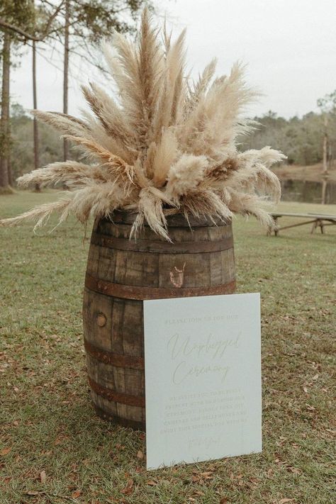 Pampas Grass Wedding Decor Isle, Western Pampas Grass Decor, Rustic Boho Reception Decorations, Pampas Grass Whiskey Barrel, Pampas Grass Barrel Arrangement, Western Wedding Bar Ideas, Western Isle Decorations, Neutral Western Wedding, Pompadour Grass Wedding