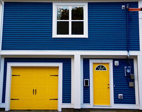 Yellow garage door house Yellow Garage Door, Colorful Garage Doors, Blue House Yellow Door, Blue And Yellow House, Door Color Ideas, Garage Door Colors, Garage Door House, Garage Door Paint, Garage Door Types