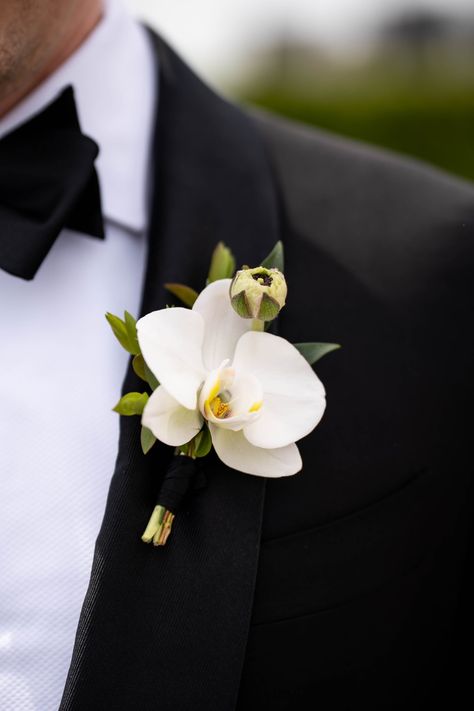 Orchid Boutonniere for Devon. Flowers: @rosehipsocial Orchid Winter Wedding Bouquet, Magnolia Boutonniere Groomsmen, All Orchid Bouquet, Small White Orchid Bouquet, Black Orchid Bouquet, Orchids Flower Bouquet, Wedding Orchids Centerpieces, Orchid Groom Boutonniere, Wedding Flowers With Orchids