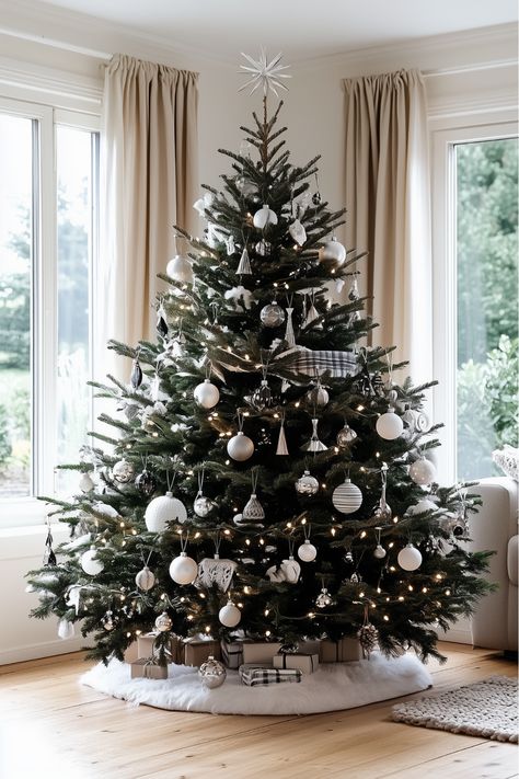 Love a chic, wintry Christmas vibe? A black Christmas tree with silver ornaments brings that icy elegance! I’d mix mirrored and metallic silver baubles, add crystal icicles, and soft white lights to finish. It’s like bringing a snowy winter wonderland indoors. Would this be your style for the season? Monochrome Christmas Tree, Christmas Tree With Silver Ornaments, Christmas Tree Color Schemes, Monochrome Christmas, Christmas Tree Colour Scheme, Silver Baubles, Black Christmas Tree, Christmas Vibe, Black Christmas Trees