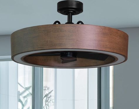 The 26-in Vanderbrook in black and walnut finish combines the style of a ceiling light along with the functionality of a ceiling fan making it a great option for your lighting and cooling needs. The Vanderbrook is equipped with a 6-speed remote control so you can maintain your ideal comfort level and a reversible motor function which allows you to change the direction of your fan from downdraft mode during the summer to updraft mode during the winter. The fan's integrated LED light kit is fully 1950 Lighting Fixtures, Office With Led Lights, Den Lighting Ideas, Hidden Fan Light Fixture, Ceiling Fan In Kitchen Ideas, Fan Above Dining Table, Industrial Farmhouse Light Fixtures, Best Bedroom Ceiling Fan, Harbor Breeze Ceiling Fan