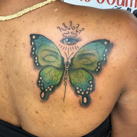 Dark Skin Tattoos | Butterfly and All Seeing Eye Tattoo | Dark Skin Body Art | Tattoo Ideas and Inspiration Colorful Butterfly Tattoo On Dark Skin, Small Tattoos Dark, Green Tattoo On Dark Skin, Colored Tattoos On Brown Skin, Tattoos Dark Skin, Color Tattoos On Dark Skin, Tattoo Dark Skin, Tattoo On Dark Skin, Tattoos On Dark Skin