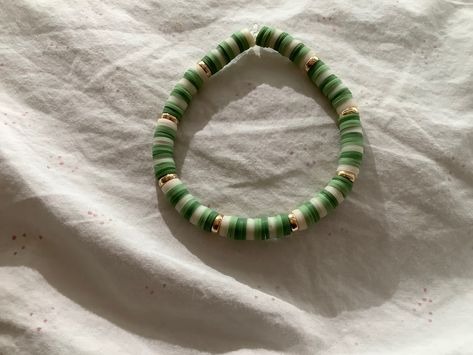 Green And Black Clay Bead Bracelet, Green Flat Bead Bracelet, Slytherin Clay Bead Bracelet, Aesthetic Green Clay Bead Bracelets, Bracelet Ideas Clay Beads Green, Earth Tone Clay Bead Bracelets, Dark Green Clay Bead Bracelet, Sage Green Clay Bead Bracelet, Clay Bead Bracelet Ideas Aesthetic Green