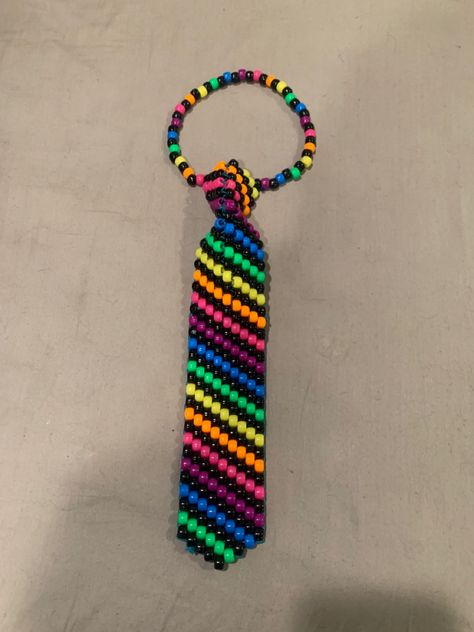 Kandi Core Outfit, Cool Kandi Patterns, Rainbow Kandi Pattern, How To Make Kandi Tie, Kandi Bracelet Patterns Templates, Scene Kandi Patterns, How To Make A Kandi Tie, Kandi Tie Tutorial, Scene Kandi Ideas