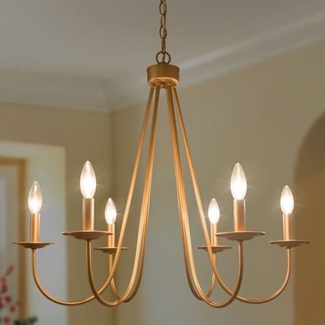 Add a touch of charm and elegance to your living spaces with the Mid-century Modern Gold Chandelier. With six delicate arms that gently curve outwards, this fixture brings graceful airiness to any contemporary room. Simple Elegant Chandelier, Brass Modern Chandelier, Gold Light Fixtures, Farmhouse Chandelier Dining Rooms Gold, Traditional Gold Chandelier, Light And Airy Living Room, Kitchen Light Fixtures, Gold Chandelier Lowes, Mid Century Modern Gold Chandelier